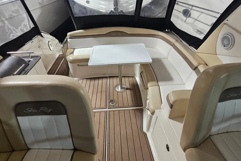 Slide: The Image of Luxurious interior of 2012 Sea Ray 370 Sundancer with seating and table. - 17