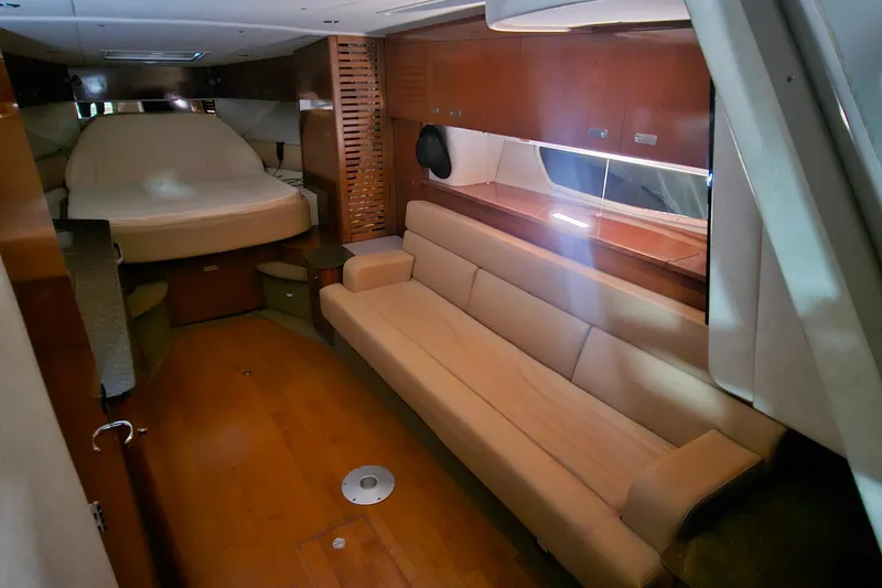 Slide: The Image of Luxurious interior of 2012 Sea Ray 370 Sundancer yacht with cozy seating and bed. - 19
