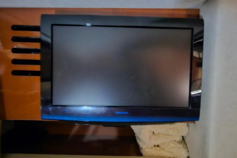 Slide: The Image of Toshiba TV mounted on a 2012 Sea Ray 370 Sundancer yacht interior. - 29