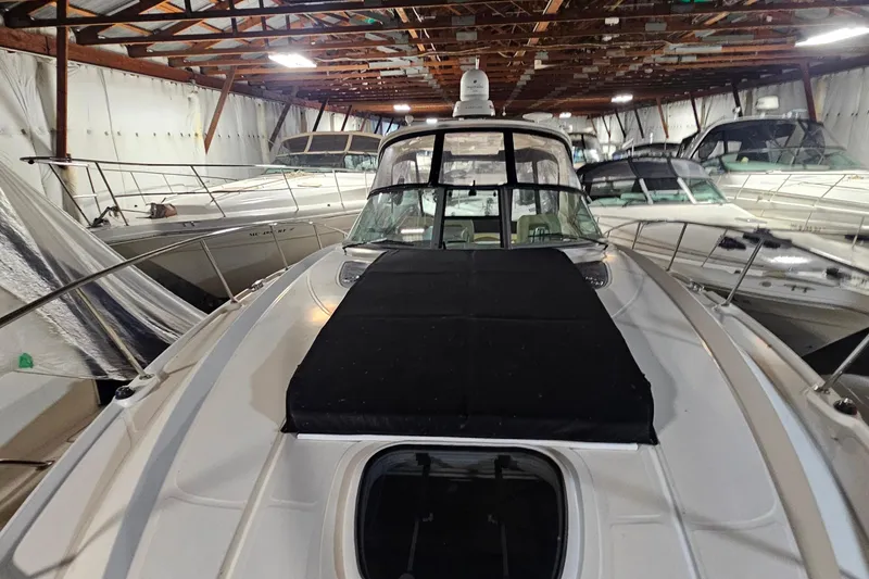Slide: The Image of 2012 Sea Ray 370 Sundancer yacht stored in a spacious indoor marina. - 35