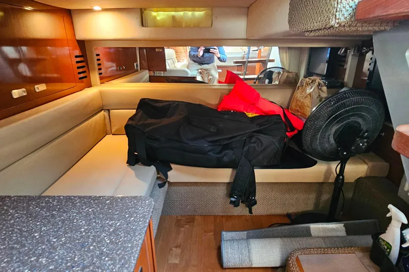 Slide: The Image of Interior of 2012 Sea Ray Sundancer 370 yacht with seating, fan, and storage items. - 39