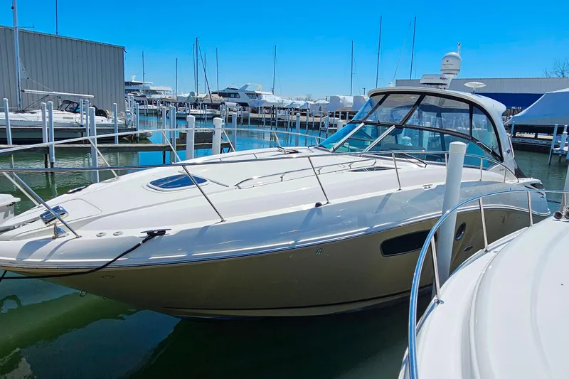 Slide: The Image of 2012 Sea Ray Sundancer 370 docked at marina under clear blue sky. - 40