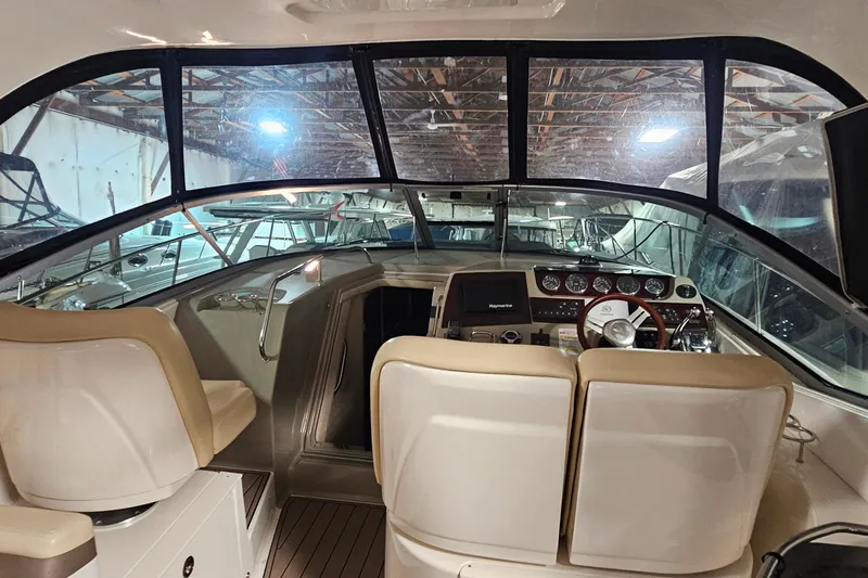 Slide: The Image of Interior view of 2012 Sea Ray 370 Sundancer yacht cockpit with steering and controls. - 7