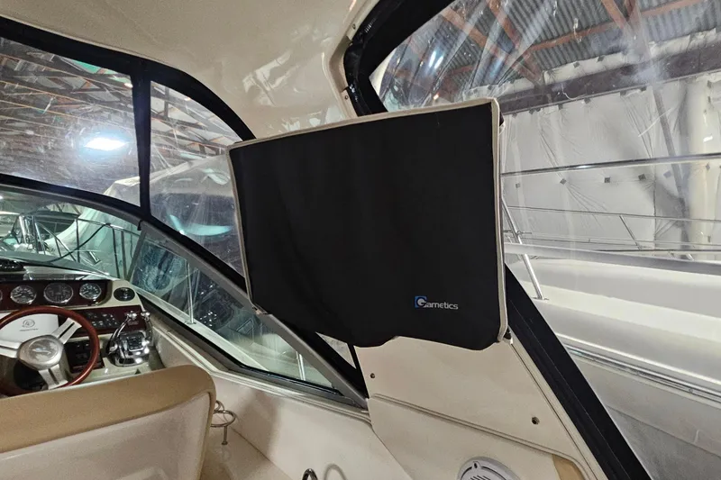 Slide: The Image of Interior of 2012 Sea Ray 370 Sundancer with covered dashboard and steering wheel. - 9