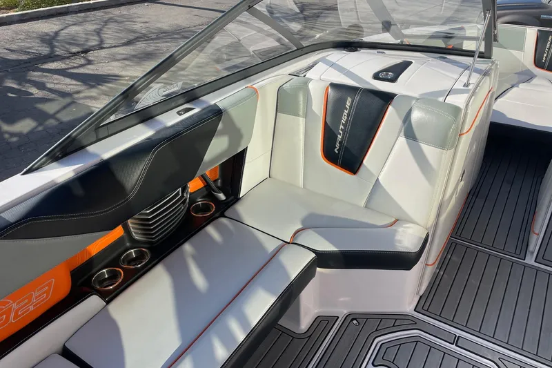 Slide: The Image of 2015 Nautique Super Air Nautique G23 interior with sleek seating and modern design. - 10