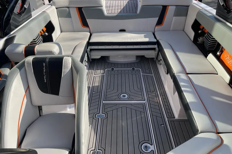 Slide: The Image of 2015 Nautique Super Air Nautique G23 interior with stylish seating and modern design. - 12