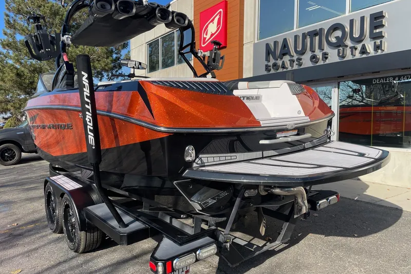 Slide: The Image of 2015 Nautique Super Air Nautique G23 boat displayed at Nautique Boats of Utah dealership. - 3