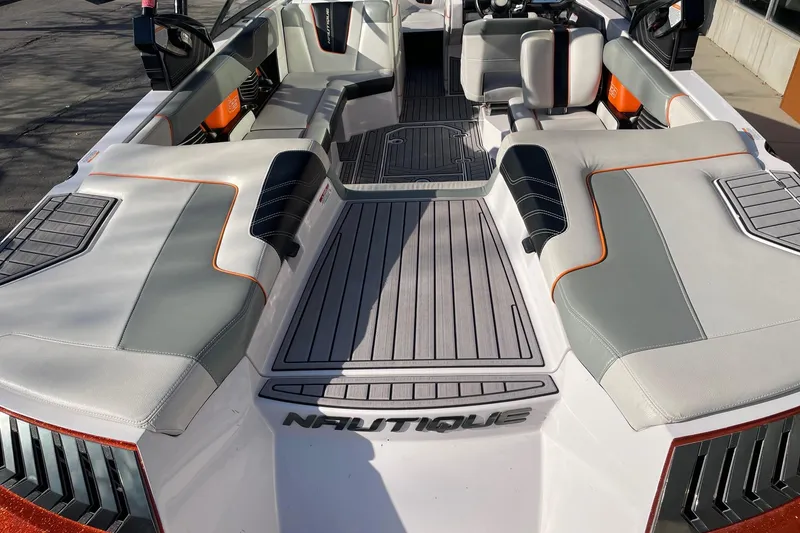 Slide: The Image of 2015 Nautique Super Air Nautique G23 boat interior with sleek seating and modern design. - 4