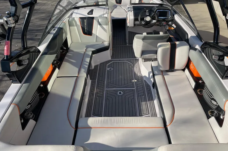 Slide: The Image of 2015 Nautique Super Air Nautique G23 interior with sleek seating and modern dashboard. - 5