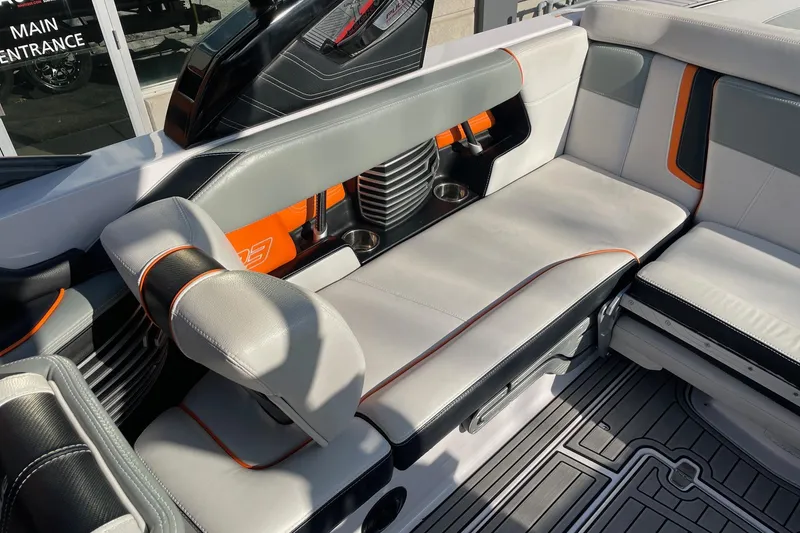 Slide: The Image of 2015 Nautique Super Air Nautique G23 interior with stylish seating and cup holders. - 7