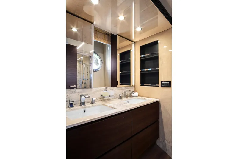 Slide: The Image of Luxurious bathroom in 2017 Azimut 72 Flybridge yacht with dual sinks and elegant finishes. - 49