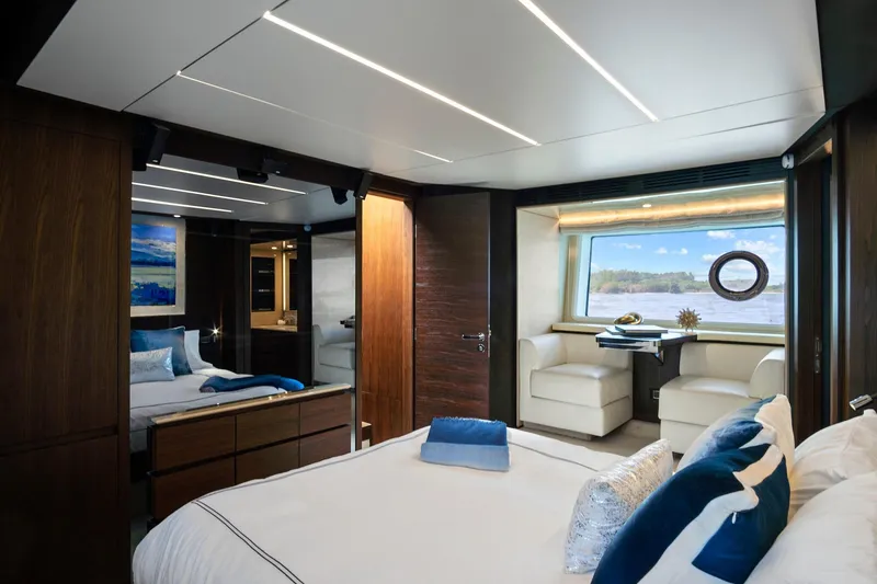 Slide: The Image of Luxurious interior of 2017 Azimut 72 Flybridge yacht with elegant bedroom and scenic window view. - 50