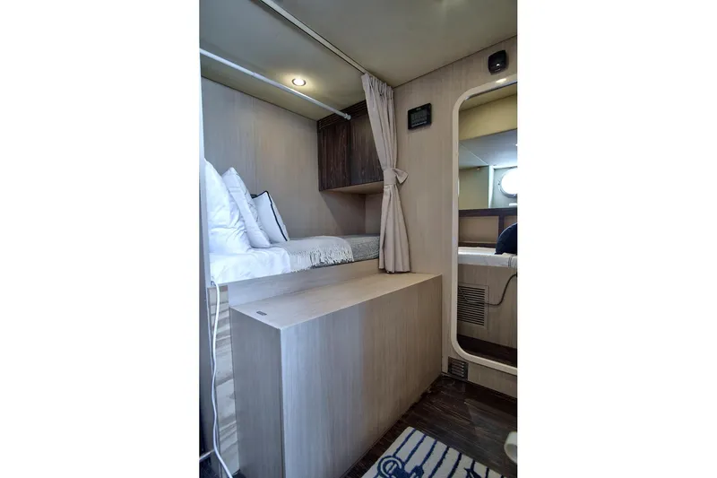 Slide: The Image of Interior cabin of 2017 Azimut 72 Flybridge yacht, featuring cozy bedding and modern design. - 56