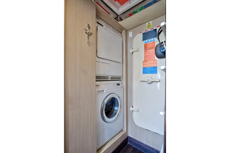 Slide: The Image of Laundry area on 2017 Azimut 72 Flybridge yacht with washer and dryer. - 57