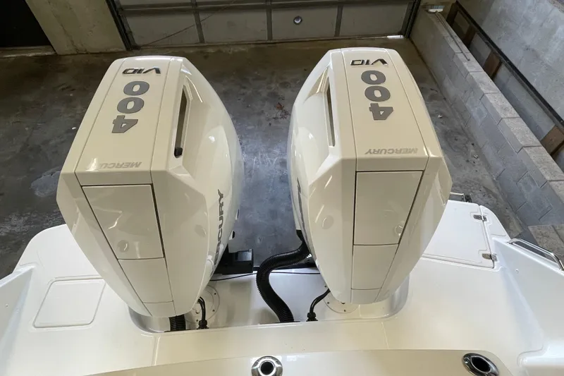 Slide: The Image of 2025 Boston Whaler 330 Vantage with twin Mercury 400 V10 outboard engines. - 15