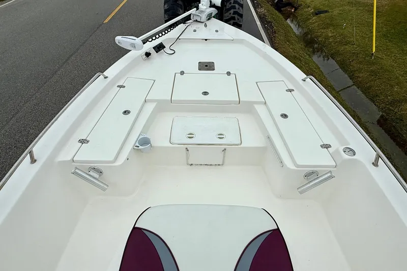 Slide: The Image of 2003 Blazer 2220 Bay boat deck with storage compartments and seating. - 12