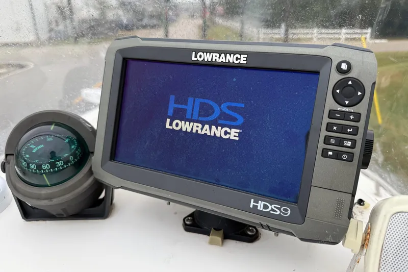 Slide: The Image of Lowrance HDS9 marine GPS and compass on 2003 Blazer 2220 Bay boat dashboard. - 15