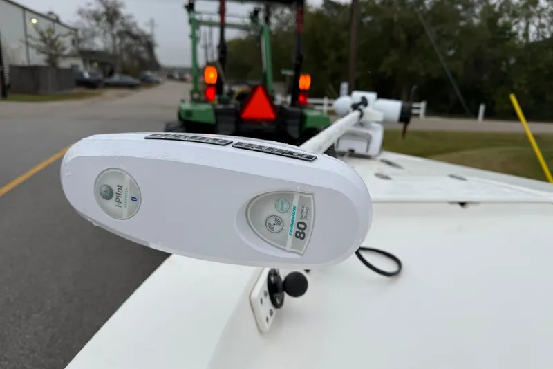 Slide: The Image of 2003 Blazer 2220 Bay boat with i-Pilot trolling motor on a road. - 16