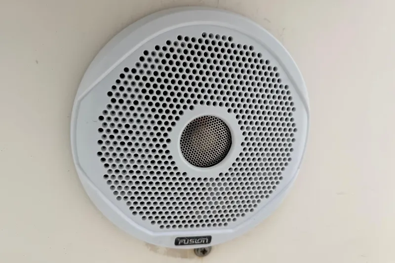 Slide: The Image of White Fusion speaker on 2003 Blazer 2220 Bay boat interior. - 18