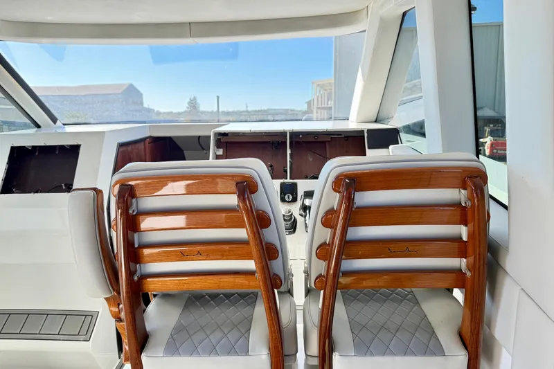 Slide: The Image of Interior view of 2021 Gulf Crosser 44 yacht with elegant wooden seating. - 18
