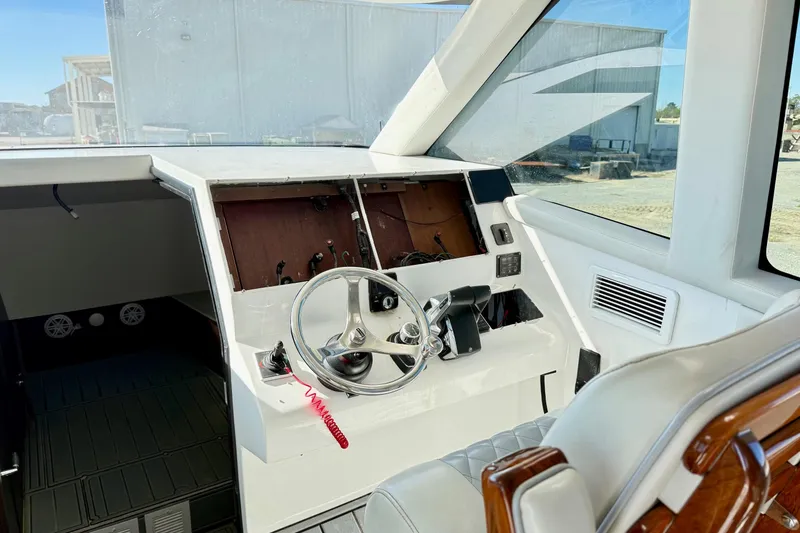 Slide: The Image of Cockpit of 2021 Gulf Crosser 44 boat with steering wheel and dashboard. - 22