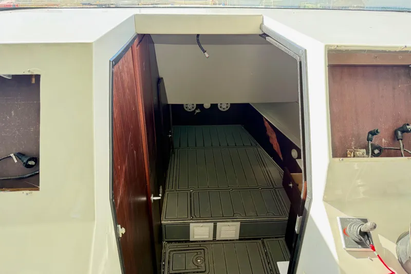 Slide: The Image of Interior view of 2021 Gulf Crosser 44 boat cabin with open door. - 24