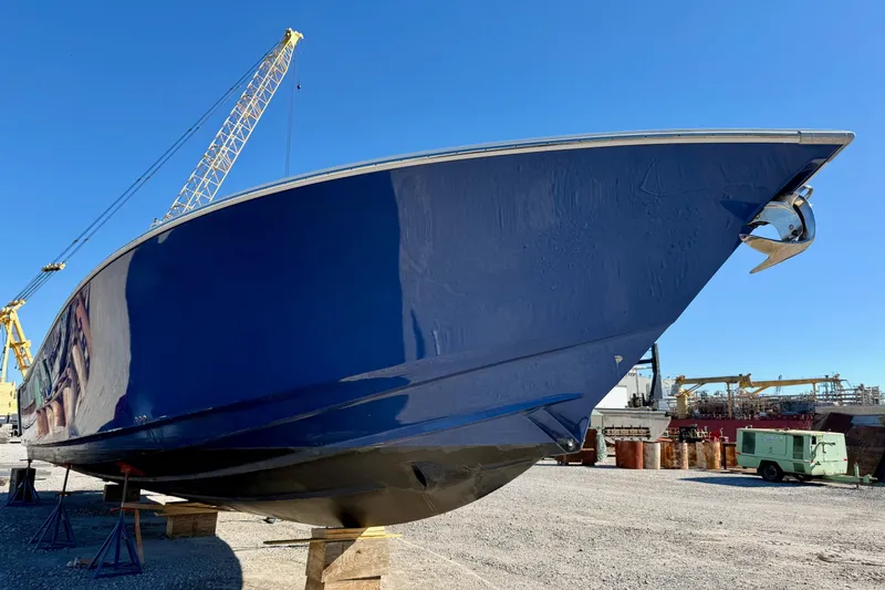 Slide: The Image of 2021 Gulf Crosser 44 boat in shipyard, blue hull, under construction. - 5