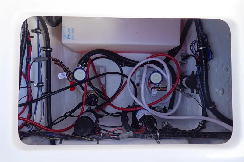 Slide: The Image of 2026 Sea Hunt BX 22 BR boat wiring and plumbing compartment. - 13