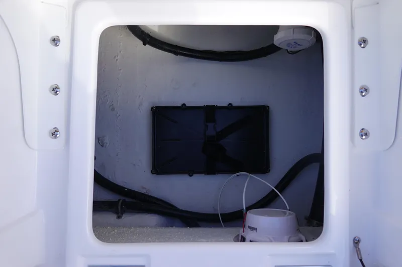 Slide: The Image of 2026 Sea Hunt BX 22 BR boat compartment with wiring and equipment. - 14