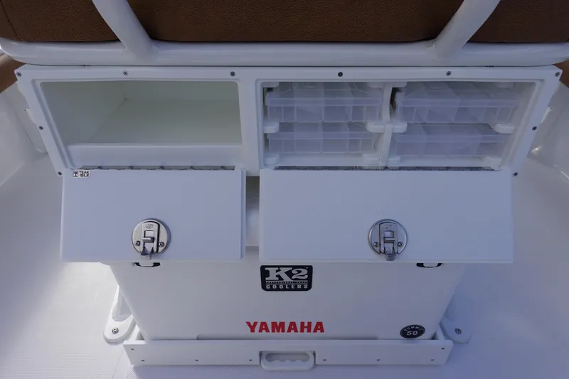 Slide: The Image of 2026 Sea Hunt BX 22 BR boat storage compartments with Yamaha branding and K2 coolers. - 16