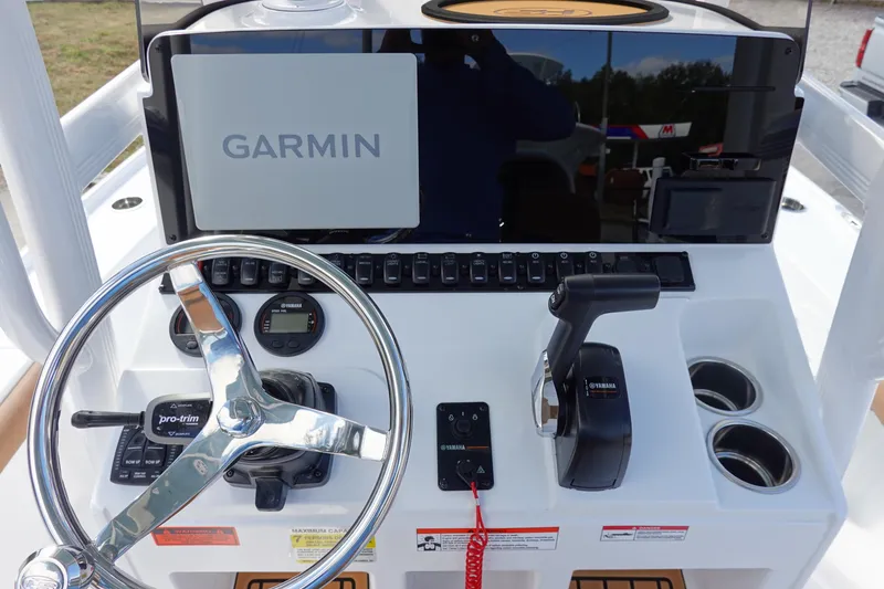Slide: The Image of 2026 Sea Hunt BX 22 BR boat dashboard with Garmin navigation system and Yamaha controls. - 19