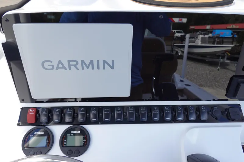 Slide: The Image of 2026 Sea Hunt BX 22 BR boat dashboard with Garmin display and Yamaha gauges. - 20