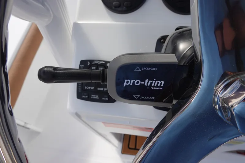 Slide: The Image of Close-up of 2026 Sea Hunt BX 22 BR boat's pro-trim control lever. - 21