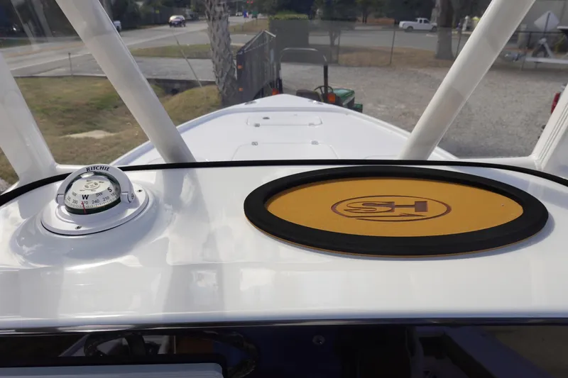 Slide: The Image of 2026 Sea Hunt BX 22 BR boat dashboard with compass and logo mat. - 22