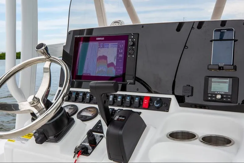 Slide: The Image of 2026 Sea Hunt BX 22 BR boat with powerful outboard motor, sunny day, palm trees in background. - 3