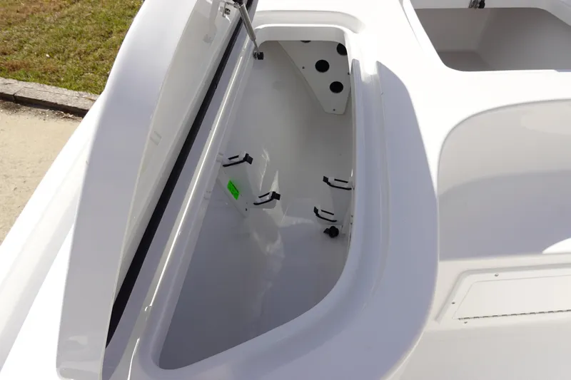 Slide: The Image of Open storage compartment on 2026 Sea Hunt BX 22 BR boat, showcasing interior space. - 32