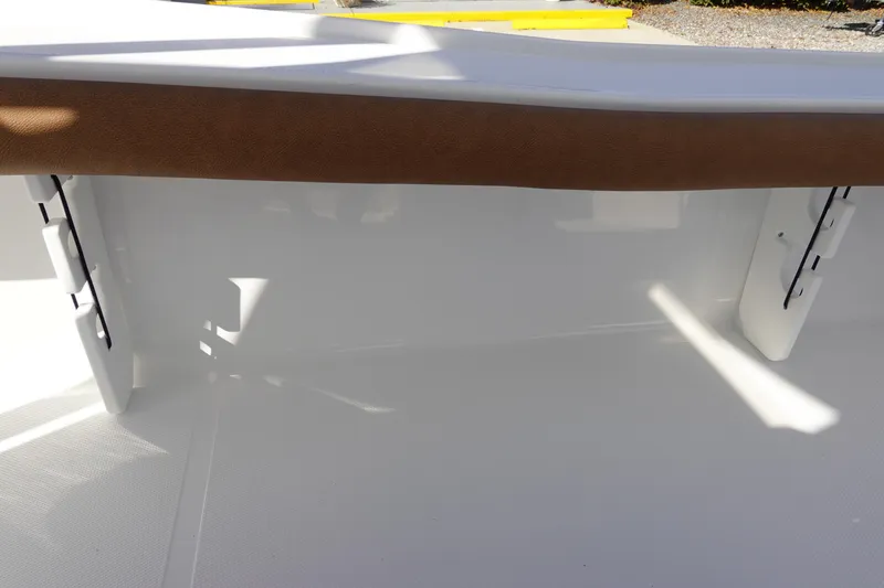 Slide: The Image of 2026 Sea Hunt BX 22 BR boat interior with white and brown accents. - 34