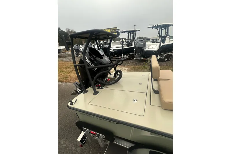 Slide: The Image of 2026 East Cape EVO 18V boat on trailer, displayed outdoors. - 4