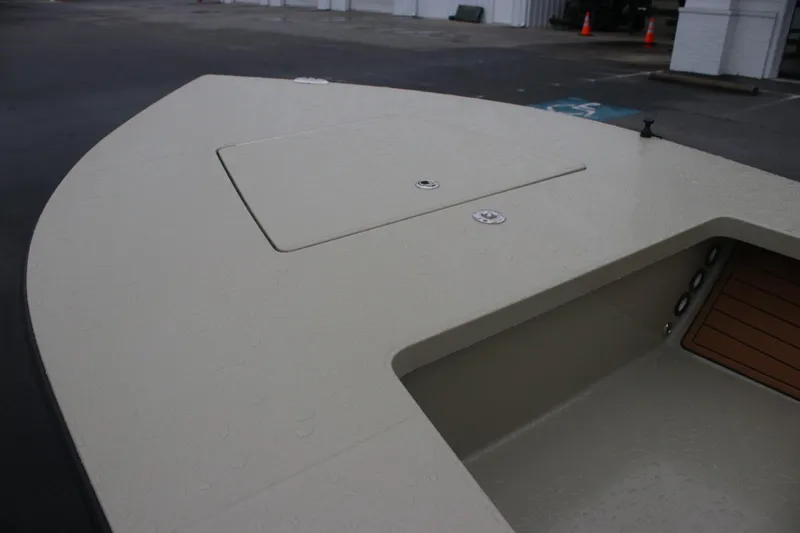 Slide: The Image of 2026 East Cape EVO 18V boat deck with storage compartment, showcasing sleek design. - 9