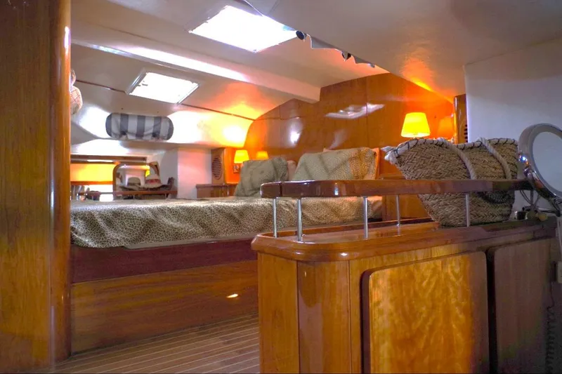 Slide: The Image of Luxurious interior of 2004 Privilege 49 yacht with cozy lighting and elegant wood finishes. - 4