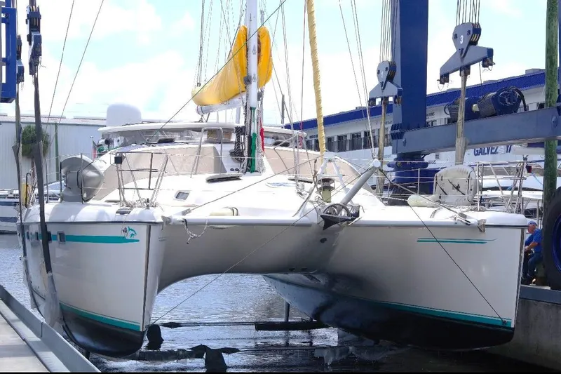 Slide: The Image of 2004 Privilege 49 catamaran in dry dock, undergoing maintenance. - 9
