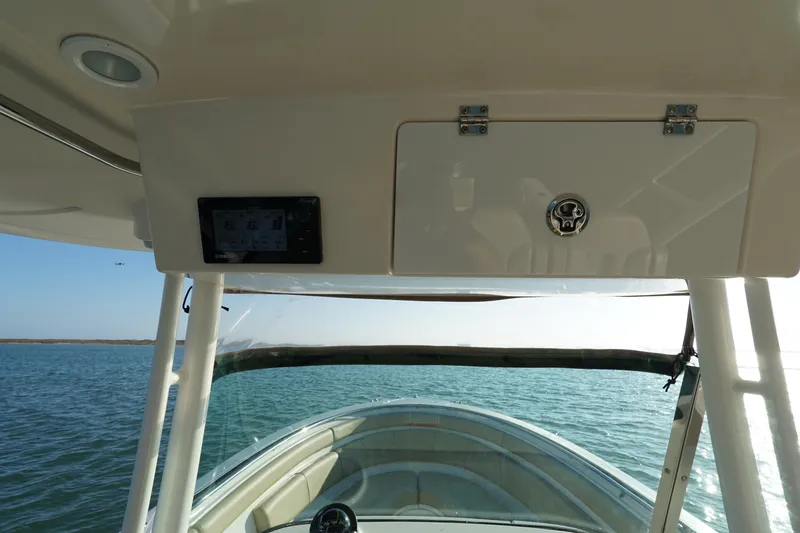Slide: The Image of 2016 Pursuit ST 310 Sport boat interior view on open water. - 18