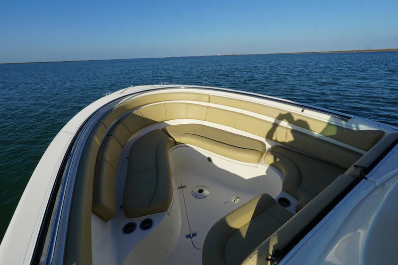 Slide: The Image of 2016 Pursuit ST 310 Sport boat with spacious seating on calm water. - 22