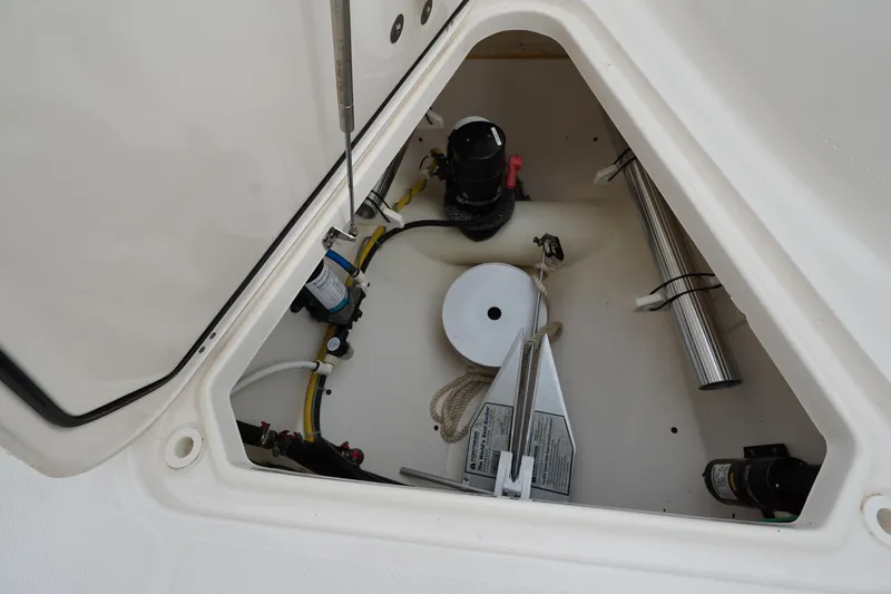 Slide: The Image of Storage compartment of 2016 Pursuit ST 310 Sport boat with equipment and accessories. - 28