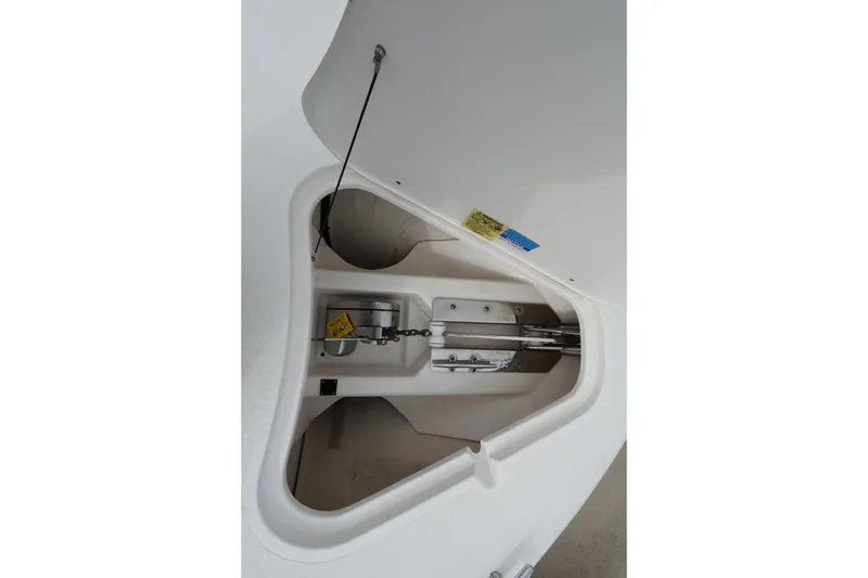 Slide: The Image of 2016 Pursuit ST 310 Sport anchor compartment with open hatch. - 30