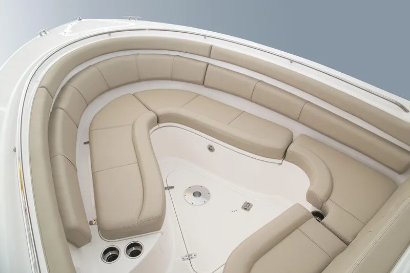 Slide: The Image of Manufacturer Provided Image: 2016 Pursuit ST 310 Sport boat with spacious beige seating area. - 33
