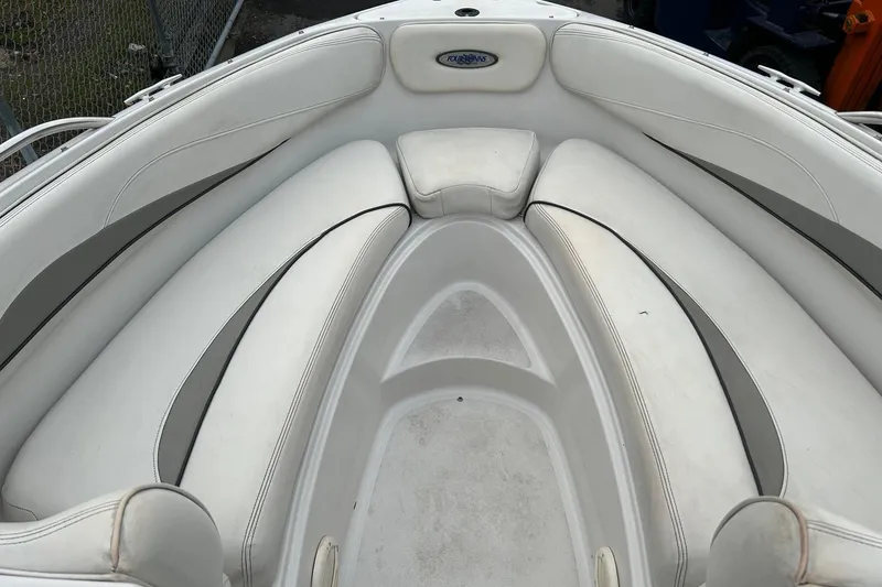 Slide: The Image of Interior view of a 2000 Four Winns 200 Horizon boat with white seating. - 13