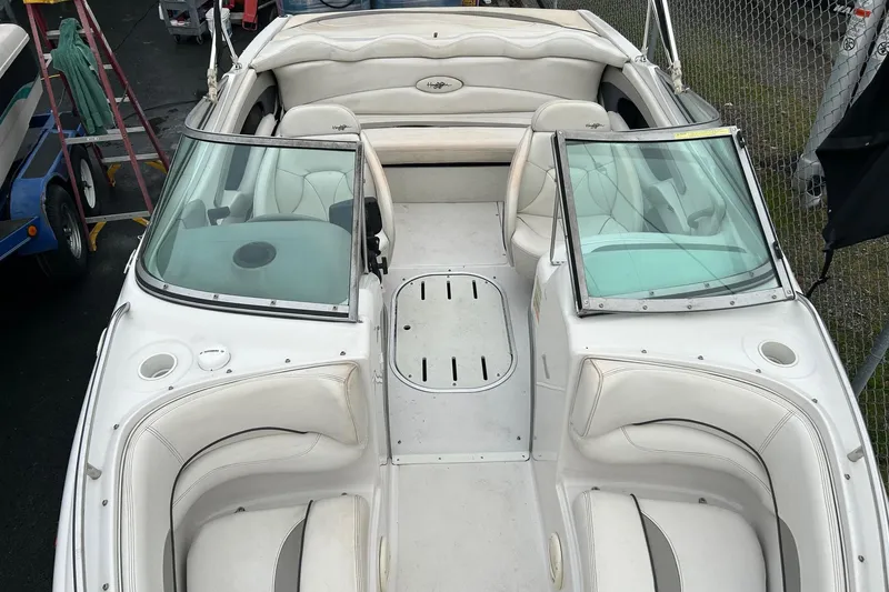 Slide: The Image of 2000 Four Winns 200 Horizon boat interior with white seating and windshield. - 15