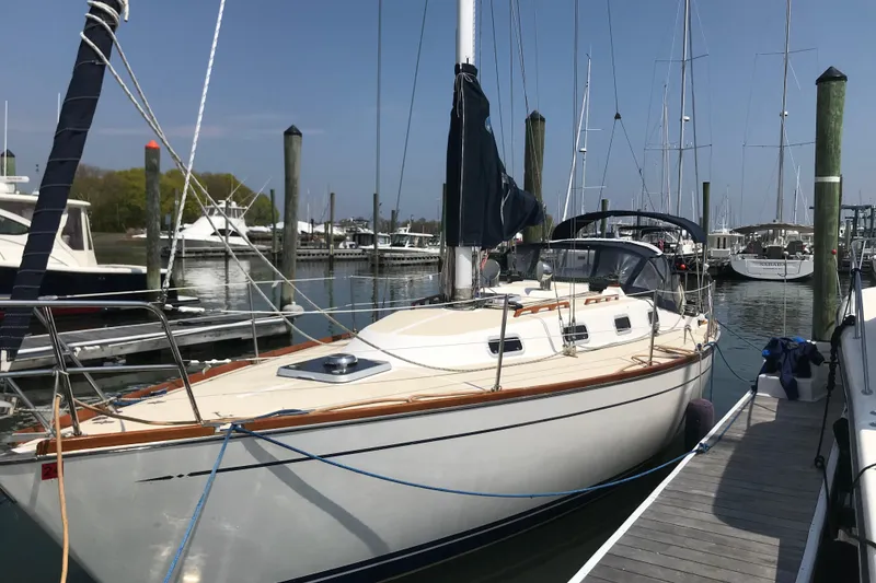 The Image of Sailboat docked at marina, 1994 Tartan 3100 model, clear sky, calm water. - 0