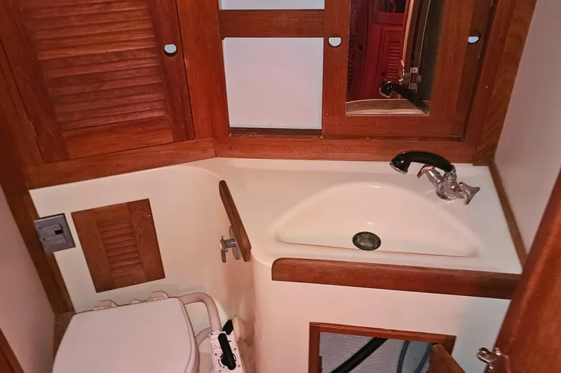 Slide: The Image of Interior of a Tartan 3100 yacht, bathroom with sink and toilet. - 17